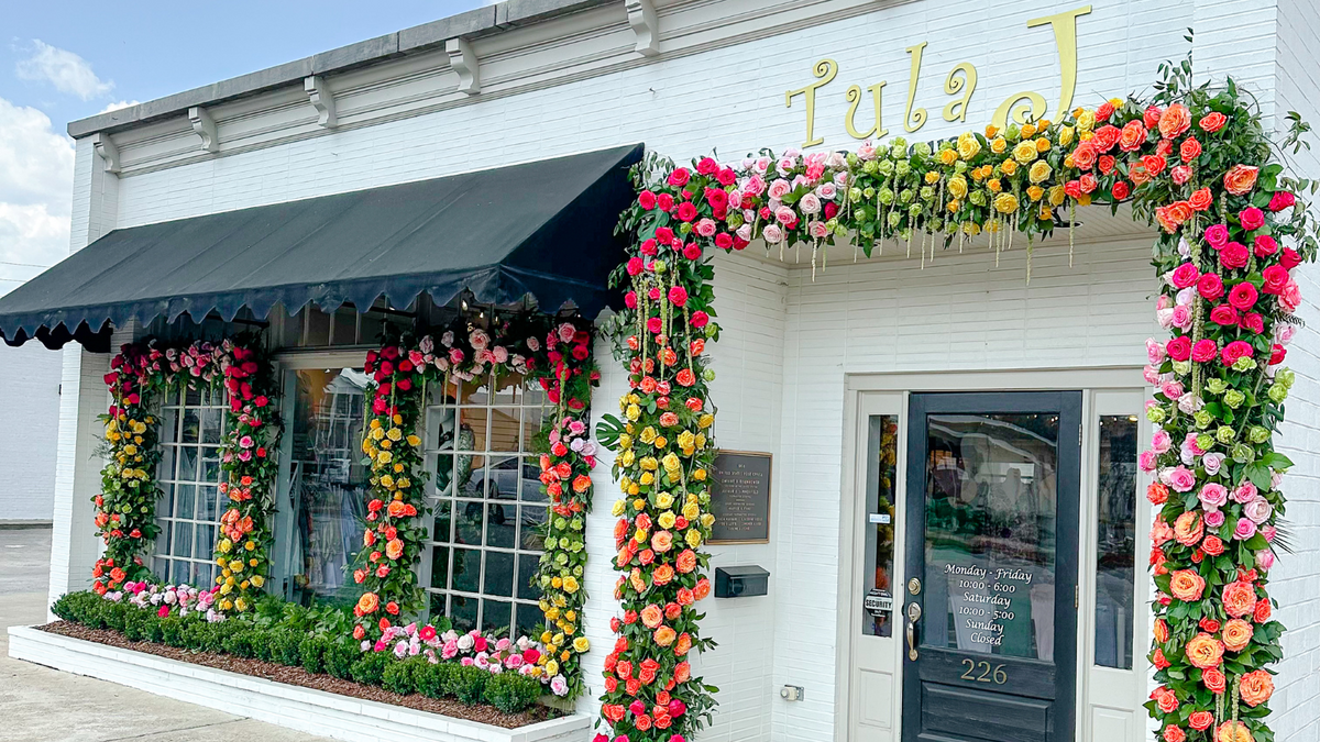 Flower-covered Tula J Boutique storefront on Main Street in downtown Trussville, Alabama